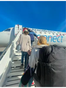 Boarding-a-plane-via-the-stairs-with-Pacsafe-backpack.webp